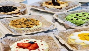 Colorful assorted desserts served in 6 inch biodegradable bamboo fiber clamshell containers with paper liners