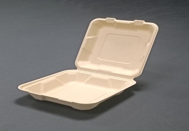 Open compostable 8-inch bamboo clamshell hinged food container on dark background