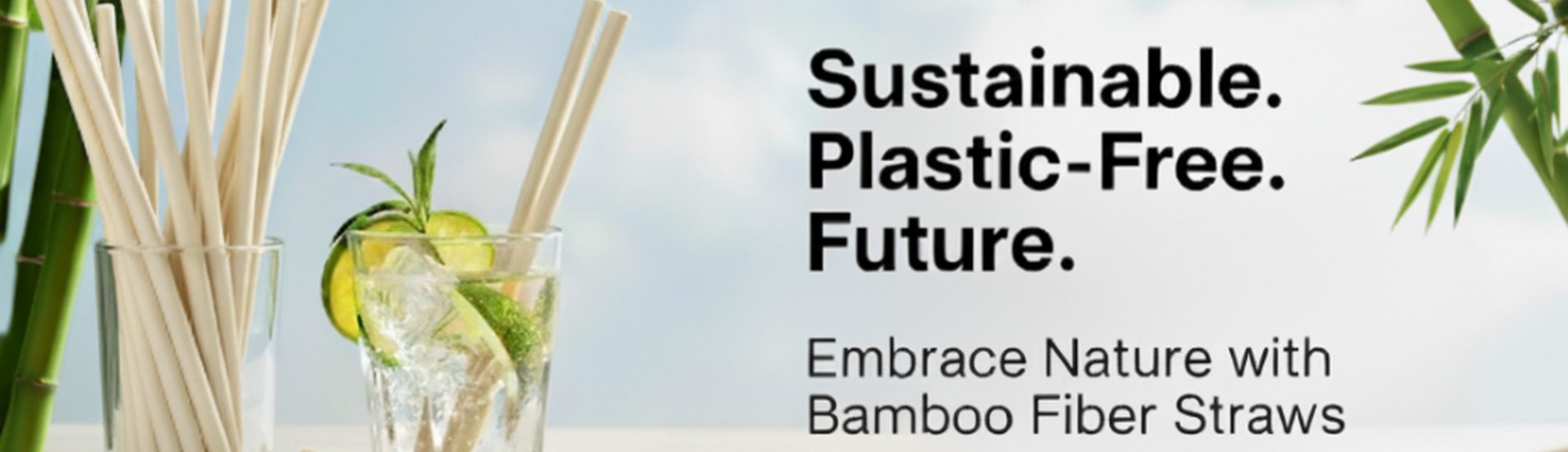 Eco-friendly bamboo fiber straws in a glass beside a refreshing drink with lime and mint, promoting sustainable and plastic-free alternatives.