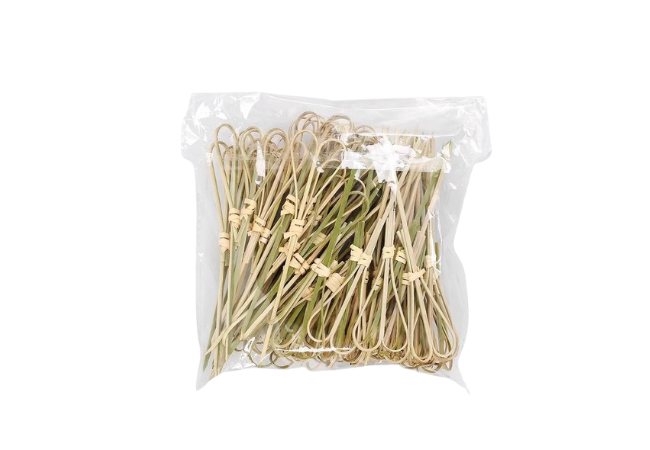 Bulk pack of natural bamboo knot skewers with double-loop design in a clear plastic bag.