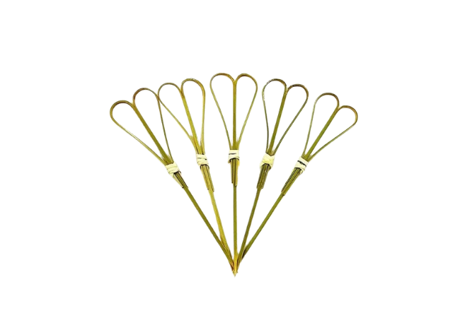 Natural green double-loop bamboo knot skewers arranged fan-style on a white background.