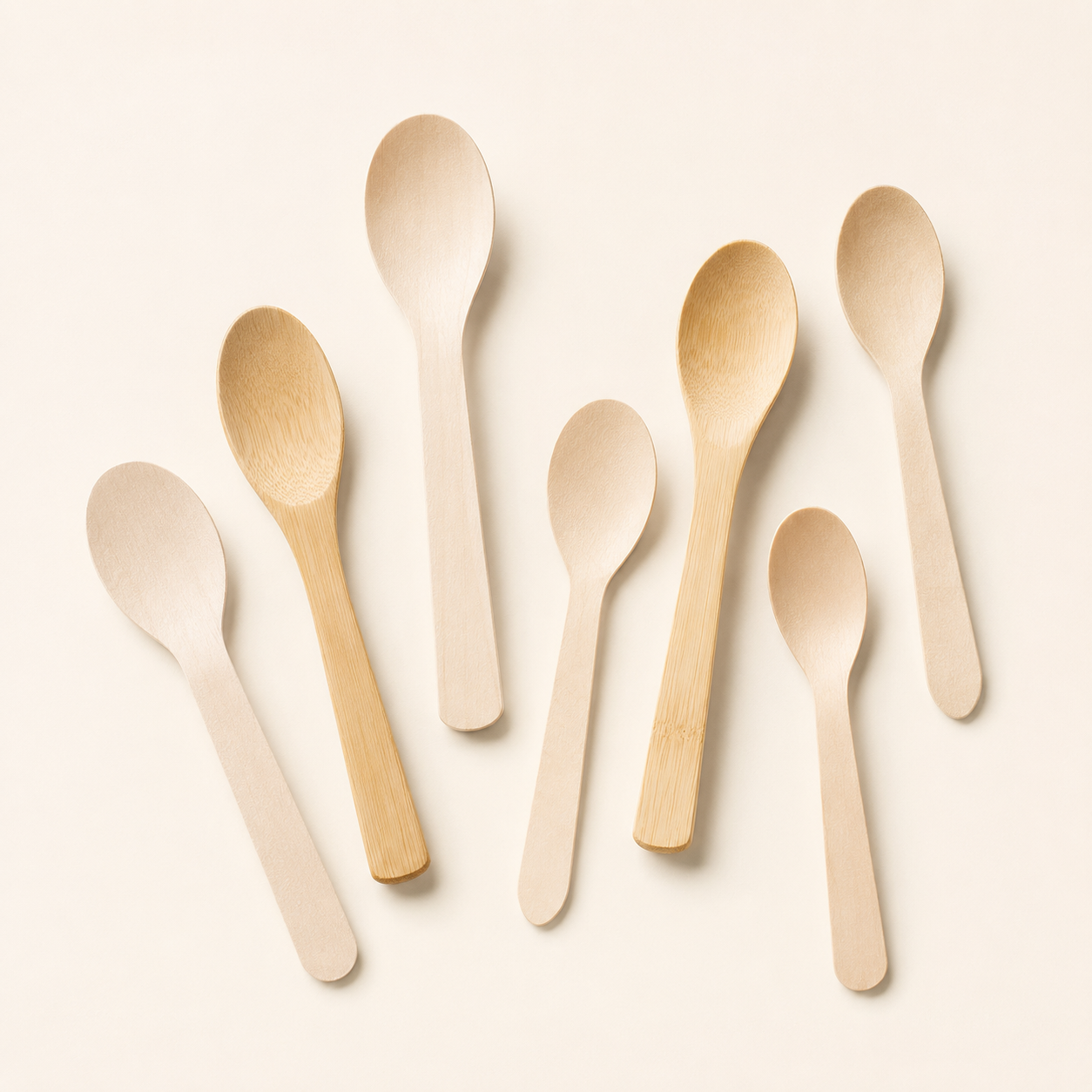 Disposable bamboo and wooden spoons for soups desserts and takeaway foodservice